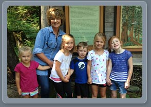 Grandma Leigh with Grandkids at the Ross Cedars